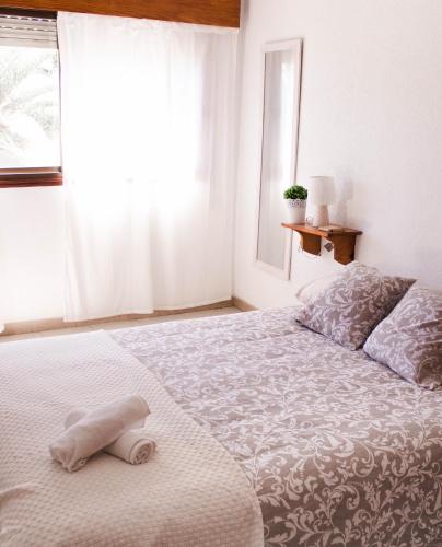 Postel nebo postele na pokoji v ubytování La Perla Beach House