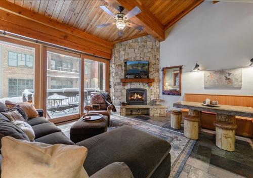a living room with a couch and a fireplace at Cozy Northstar Village Condo Walk to Lifts 2 Full BA Excellent Location in Truckee
