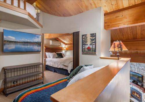 a room with a bedroom with a bed and a desk at Cozy Northstar Village Condo Walk to Lifts 2 Full BA Excellent Location in Truckee