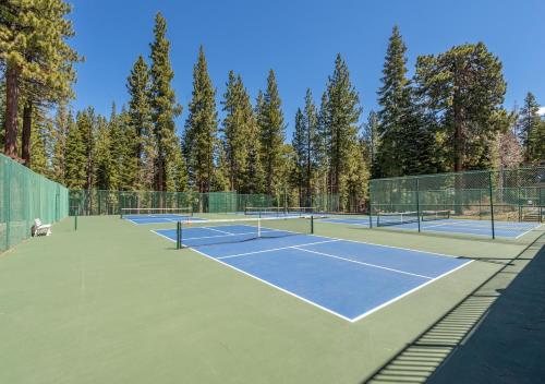 a couple of tennis courts with trees in the background at Cozy Northstar Village Condo Walk to Lifts 2 Full BA Excellent Location in Truckee