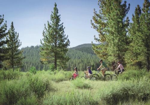 a group of people riding bikes in a field at Cozy Northstar Village Condo Walk to Lifts 2 Full BA Excellent Location in Truckee
