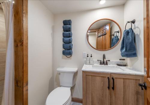 a bathroom with a toilet and a mirror at Northstar Village Condo Walk to Lifts 2 Full BA Excellent Location Hot-Tubs in Truckee