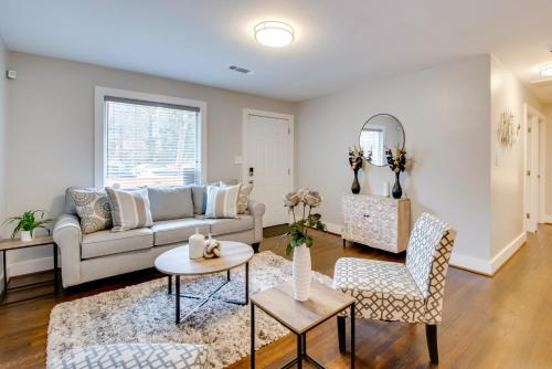 a living room with a couch and a table at 6 Mi to World Cup! Pet-Friendly ATL Home with Yard in Atlanta