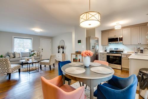 a kitchen and living room with a table and chairs at 6 Mi to World Cup! Pet-Friendly ATL Home with Yard in Atlanta