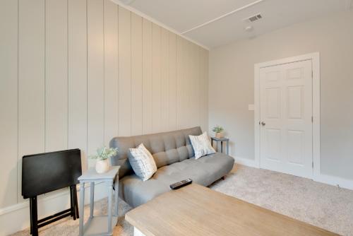 a living room with a couch and a tv at 6 Mi to World Cup! Pet-Friendly ATL Home with Yard in Atlanta