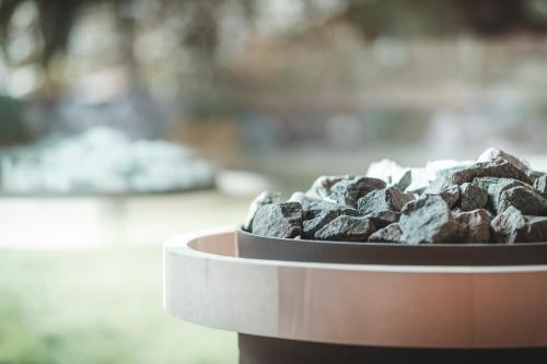 a bowl of gray rocks in a bowl at Hotel Alpenblick in Sesto