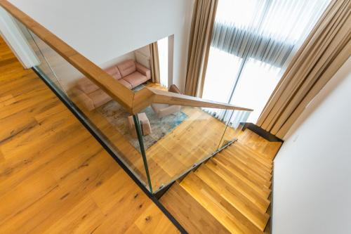 an overhead view of a glass staircase in a house at Aparthotel Phoenix in Bjelašnica