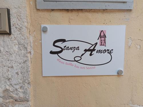 a sign on a wall that says sigma a move at Borgo Insieme in San Donato Val di Comino