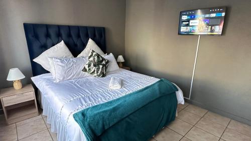 Ένα ή περισσότερα κρεβάτια σε δωμάτιο στο Nyasa Guest House in Johannesburg