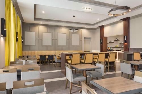 a dining room with tables and chairs in a restaurant at Homewood Suites by Hilton Philadelphia-City Avenue in Philadelphia