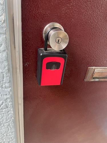 a lock on a door with a red box at Azumi Relax Lodge201 in Azumino