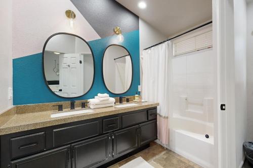 a bathroom with a sink and a mirror at Deerbrook Manor Permit# 67085 in La Quinta