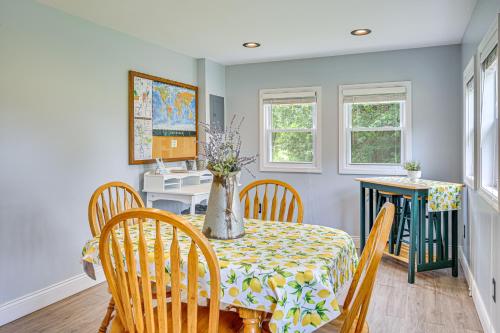a dining room with a table with a vase on it at Peaceful Murray Home about 8 Mi to Kentucky Lake! in Murray