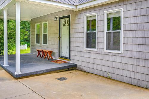 a front porch of a house with a table at Peaceful Murray Home about 8 Mi to Kentucky Lake! in Murray