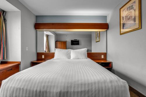 a bedroom with a large white bed in it at The Block Hotel in Bentonville
