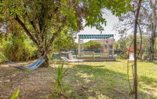 a hammock in a park with a playground at 3 Bedroom Nice Home In Fivizzano in Fivizzano