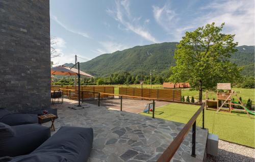 a patio with a tennis court in a field at Amazing Home In Rizvanusa in Gospić