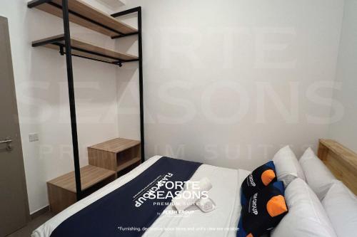 a room with a bed with a sign that says coffee seasons at Forte Seasons Mossaz Premium Suites Petaling Jaya in Petaling Jaya