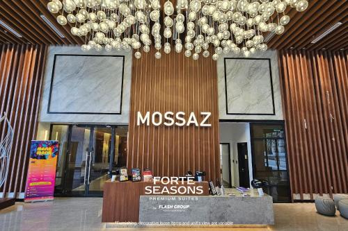 a moxaz store with a chandelier in a lobby at Forte Seasons Mossaz Premium Suites Petaling Jaya in Petaling Jaya