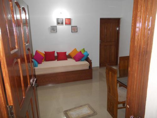 Ένα ή περισσότερα κρεβάτια σε δωμάτιο στο Goaesha Apartment