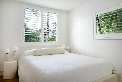 Giường trong phòng chung tại Noosa International Apartment 147 - Just Moments from the Beach