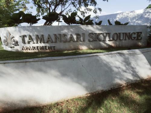 a sign for the panamaan sky exchange apartment at Skylounge Makassar Apartment in Manda