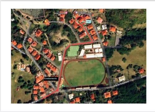an overhead view of a city with houses andyards at Les Âmes-Claires 2 in Terre-de-Haut