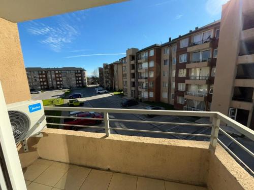 a balcony with a view of a parking lot at Apartamento Boldo Curico in Curicó