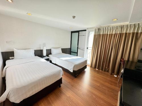 Ένα ή περισσότερα κρεβάτια σε δωμάτιο στο I Residence Hotel Sathorn