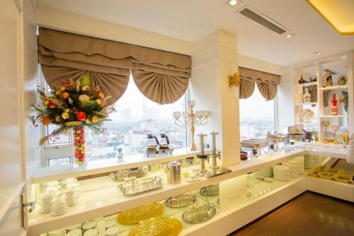 a store with a window filled with lots of food at Hoa Hong Hotel - Xa Dan in Hanoi