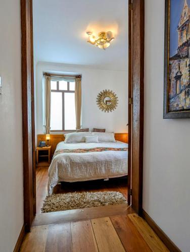 Кровать или кровати в номере Vista del Angel Hotel Boutique