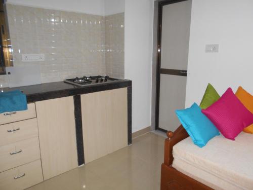 Η κουζίνα ή μικρή κουζίνα στο Goaesha Apartment