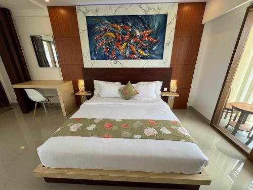 Ένα ή περισσότερα κρεβάτια σε δωμάτιο στο GM Guest House Canggu