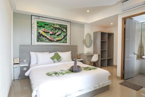 Ένα ή περισσότερα κρεβάτια σε δωμάτιο στο GM Guest House Canggu
