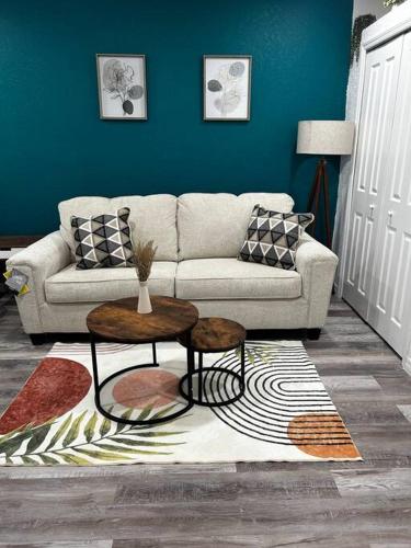 a living room with a couch and a table at Private Studio Suite in Central Orlando With Full kitchen in Orlando