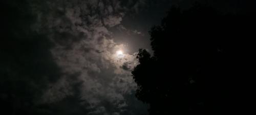 a moon in the sky at night with clouds at Apartment-Pura Vida-wi-fi-6 people, AC- parking-river-garden in Fortuna
