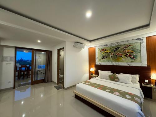 Ένα ή περισσότερα κρεβάτια σε δωμάτιο στο GM Guest House Canggu