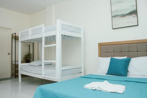 Ένα ή περισσότερα κρεβάτια σε δωμάτιο στο Amar Residence