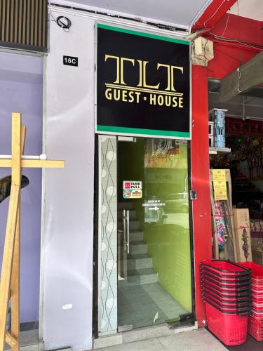 a store front of a guest house with the door open at TLT GUEST HOUSE in Sarikei