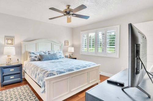 a bedroom with a bed and a ceiling fan at Perfect Match on Baywood Lane in Wesley Chapel