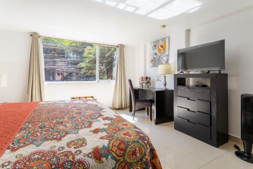 Ένα ή περισσότερα κρεβάτια σε δωμάτιο στο Suites 259 Condesa