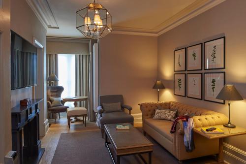 a living room with a couch and a chair at The Milner York in York