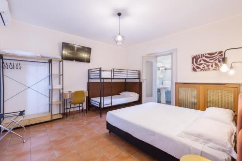 a bedroom with a bed and a table and chairs at Hotel Castello in Turin
