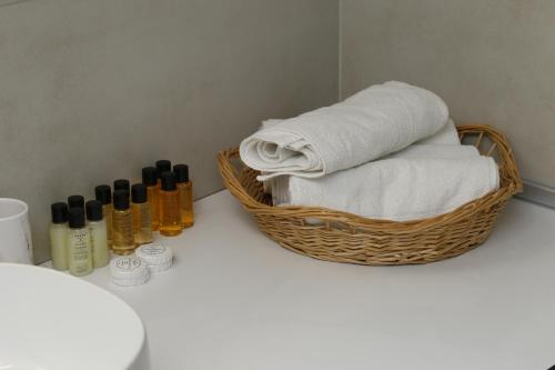 a basket with towels and other products on a counter at SaraRose in Sarajevo