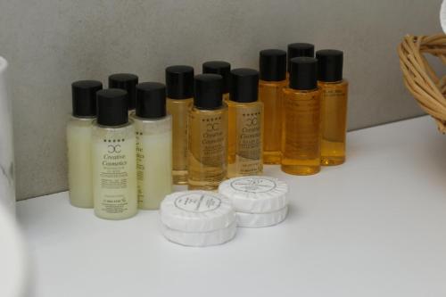 a group of bottles of oils sitting on a shelf at SaraRose in Sarajevo