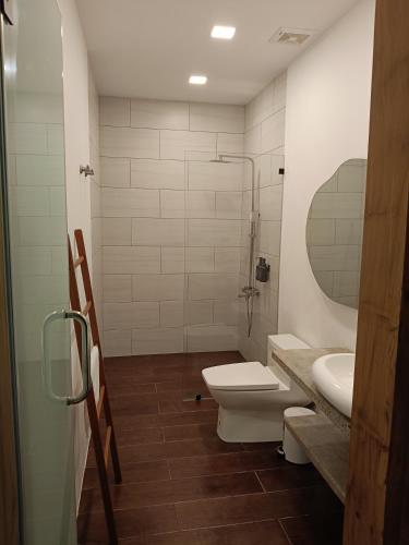 a bathroom with a toilet and a sink at 928 Caxa Juan in Dipolog
