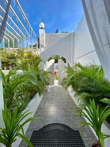a walkway with plants in a building at Scenery Resort & Spa in Tagaytay