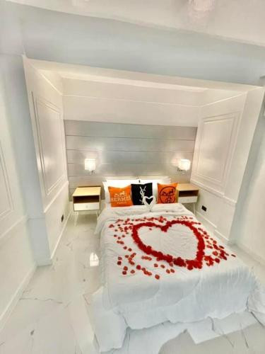 a large bed with a heart made out of red roses at Scenery Resort & Spa in Tagaytay