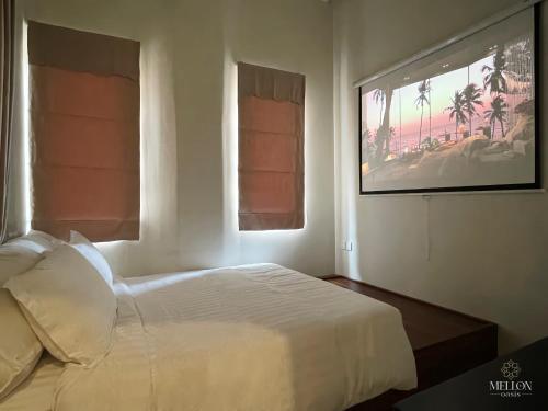 Postel nebo postele na pokoji v ubytování Mellon OASIS Phu Quoc