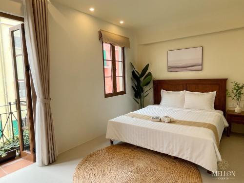 Postel nebo postele na pokoji v ubytování Mellon OASIS Phu Quoc